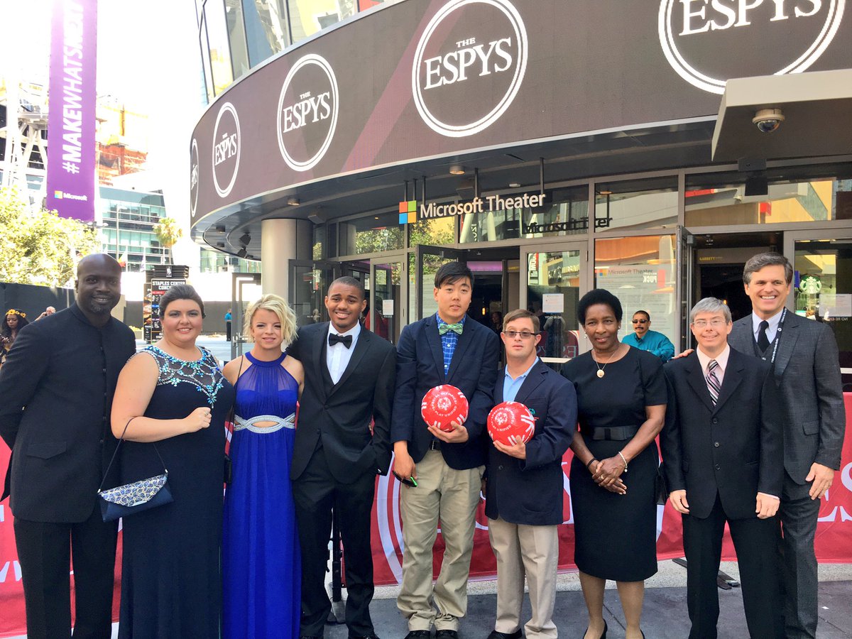 Daina in her fabulous blue dress with other seven athletes and Tim Shriver on the Red Carpet